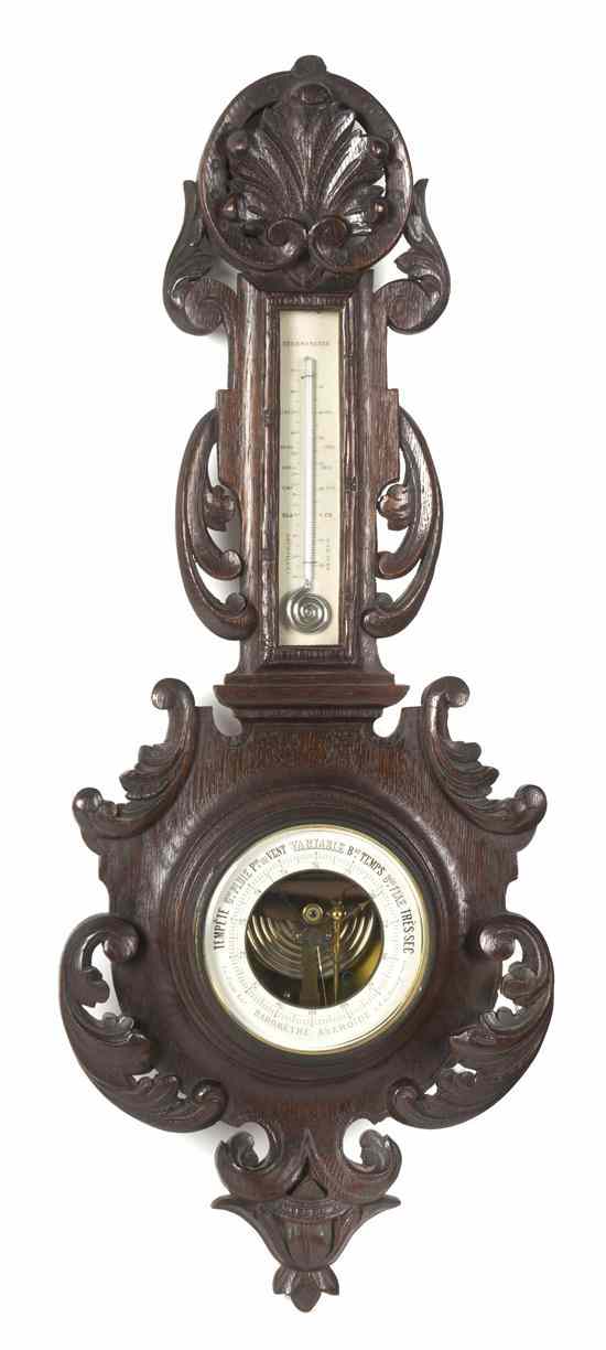 Appraisal: A French Black Forest Style Wheel Barometer having a shell