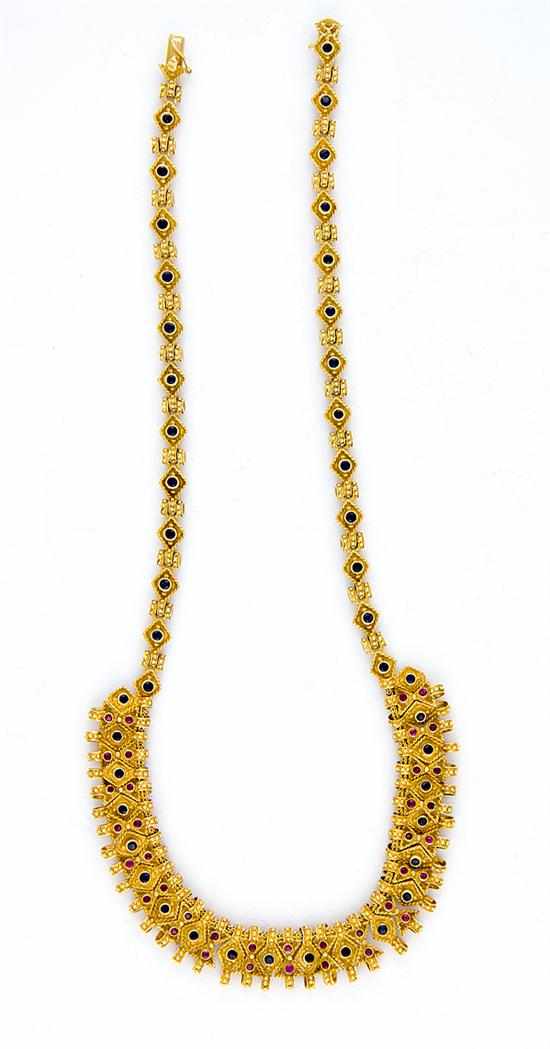 Appraisal: Ruby sapphire and gold necklace articulated K yellow gold links