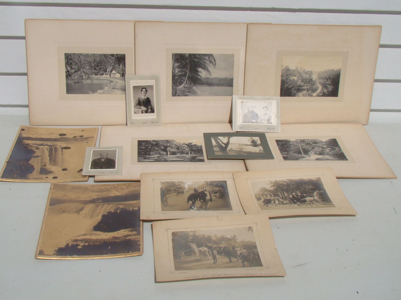 Appraisal: PHOTOGRAPHY Fourteen unframed black and white photographs mounted on board