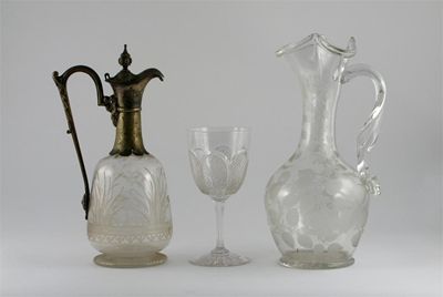 Appraisal: Two glass jugs the larger with a twisted strap handle