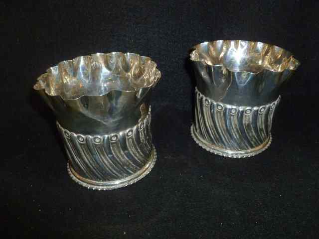 Appraisal: A PAIR OF SILVER COASTERS of cylindrical form with crimped