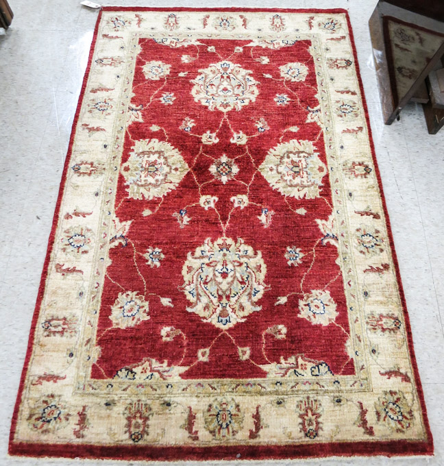 Appraisal: HAND KNOTTED ORIENTAL AREA RUG Pakistani Persian floral vine and