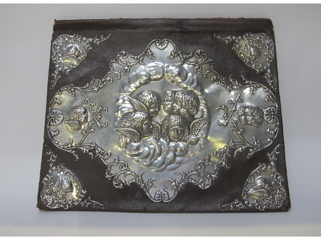 Appraisal: An Edwardian silver mounted leather desktop blotter decorated in raised