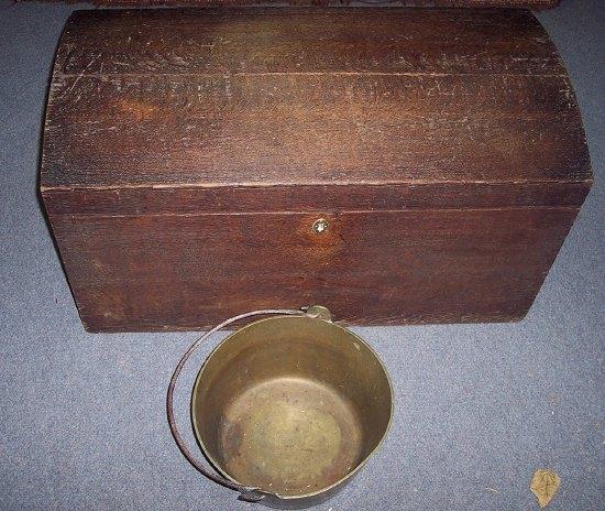 Appraisal: A th Century oak chest with domed lid and carrying