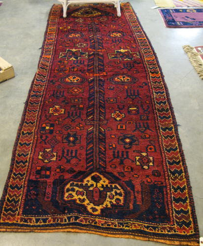 Appraisal: PERSIAN SHIRAZ CARPET overall geometric and stylized animal decoration on