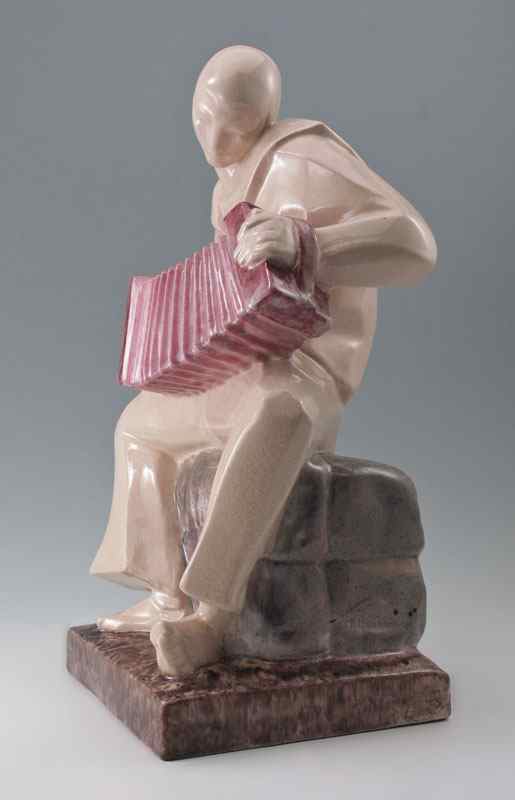 Appraisal: MARCEL BOURAINE DECO STYLE PORCELAIN SCULPTURE OF SAILOR ACCORDIAN PLAYER