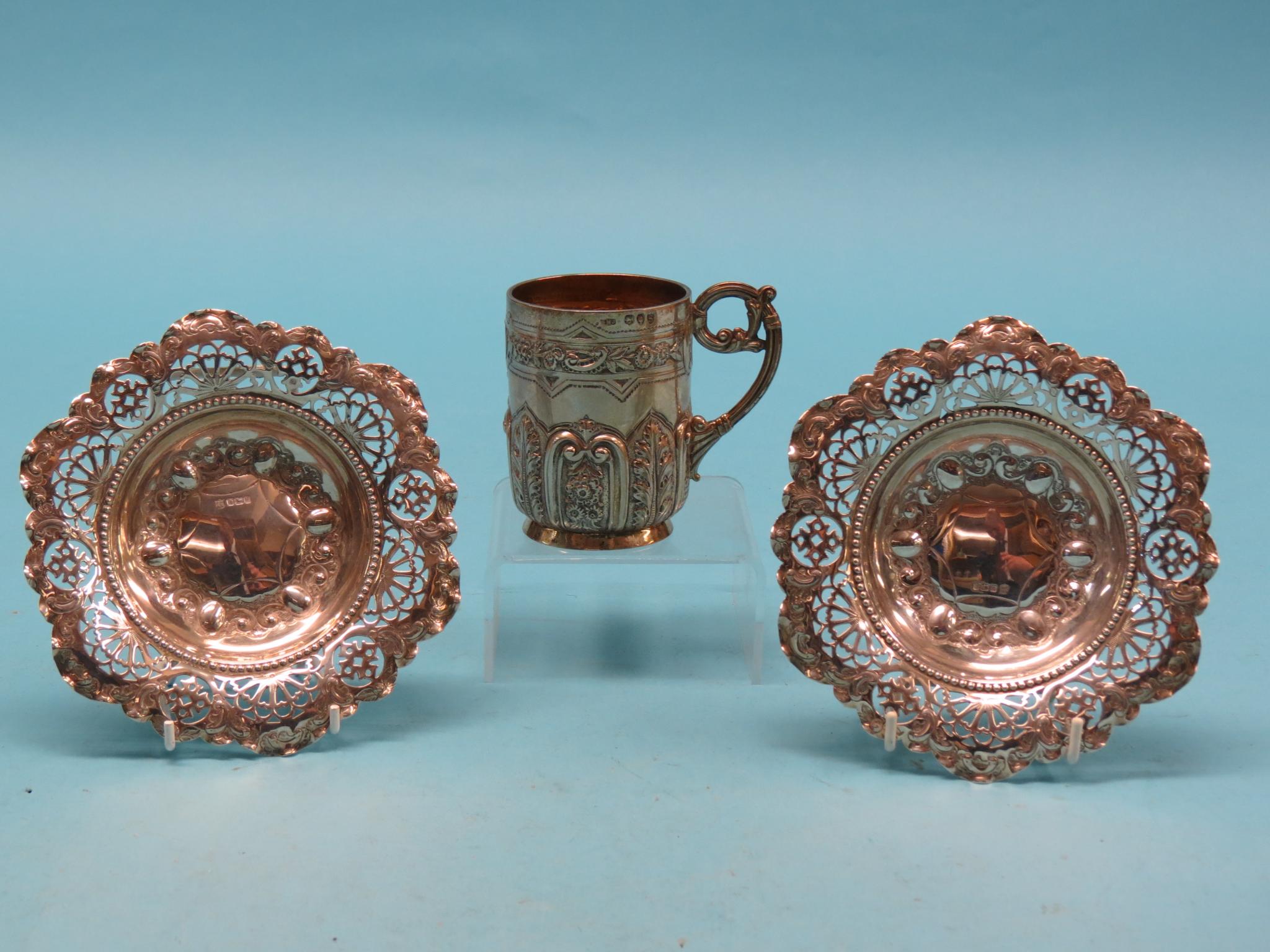 Appraisal: A Victorian embossed silver christening mug London and a pair