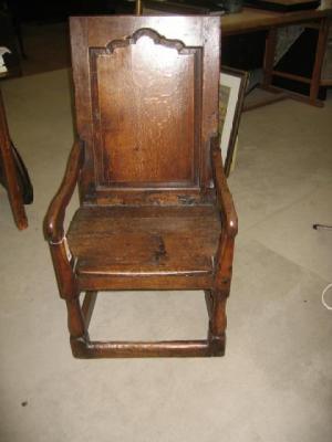 Appraisal: AN OAK WAINSCOT ELBOW CHAIR the solid square back with