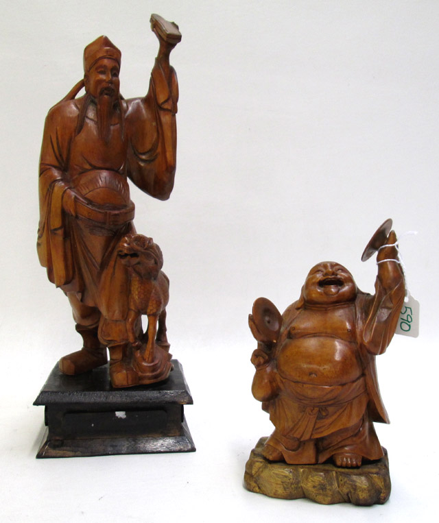 Appraisal: TWO JAPANESE WOOD CARVED FIGURES of a Buddha with cymbals