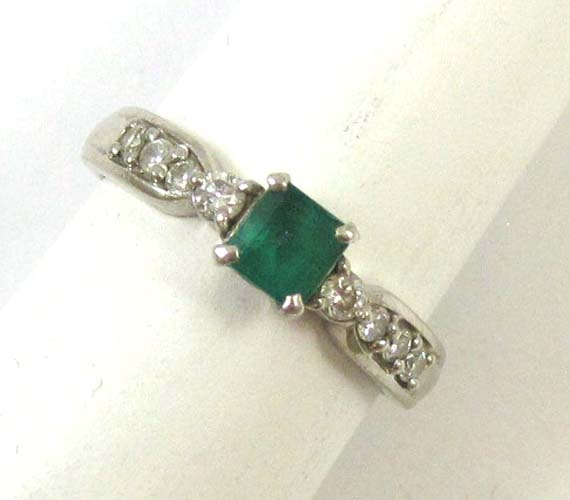 Appraisal: EMERALD DIAMOND AND PLATINUM RING with four round-cut diamonds set