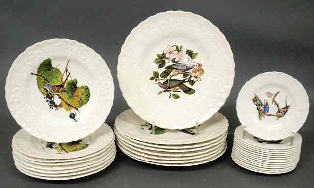 Appraisal: Partial china service each decorated with birds reproduced from the