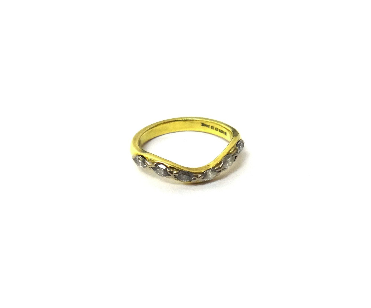 Appraisal: An ct gold ring mounted with a row of six