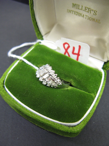 Appraisal: DIAMOND AND EIGHTEEN KARAT WHITE GOLD RING set with eleven