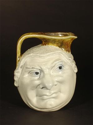 Appraisal: A Martin Brothers stoneware Barrister face jug by Robert Wallace