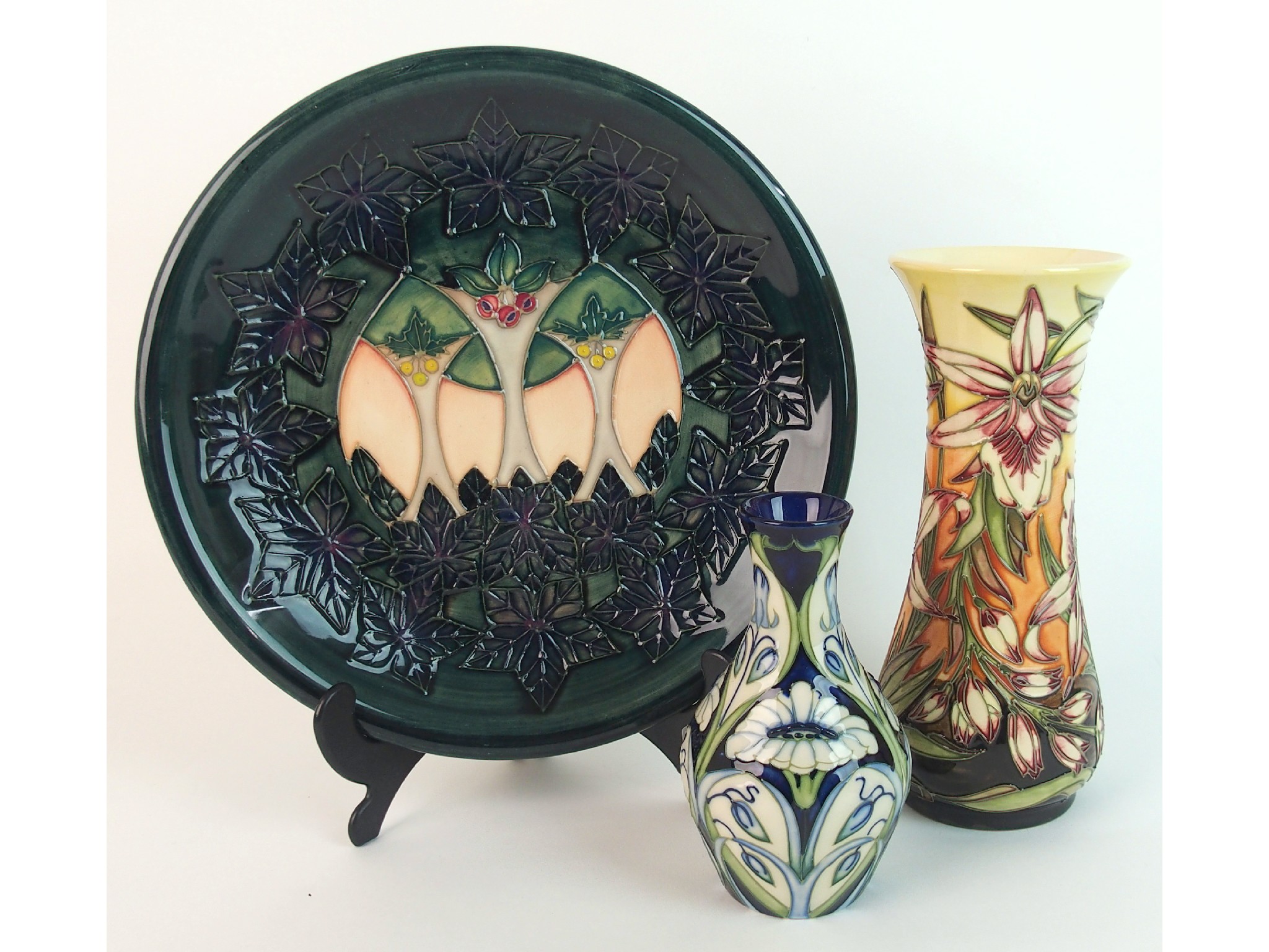 Appraisal: Three pieces of Moorcroft pottery Sunderland Rain Daisy and Clunya