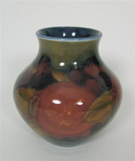 Appraisal: MOORCROFT BALUSTER VASE CIRCA glazed earthenware tube line decoration in