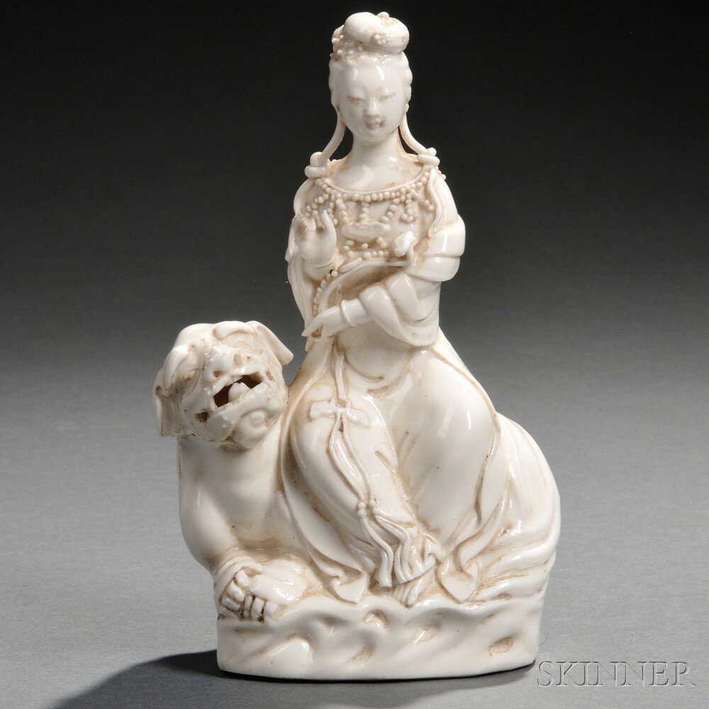 Appraisal: Blanc-de-Chine Guanyin Riding on a Foo Lion China Qing Dynasty