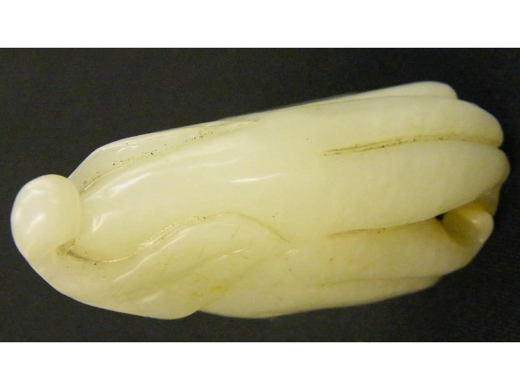 Appraisal: Russet brown and pale coloured pierced jade carving modelled as