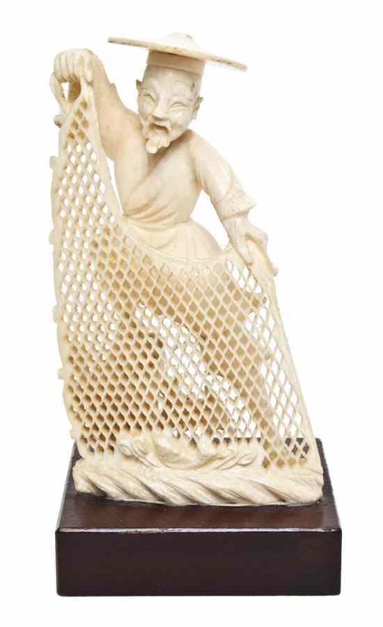 Appraisal: A Chinese Carved Ivory Figure of a Fisherman depicting the