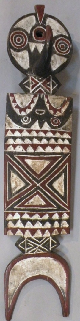 Appraisal: An African wooden tribal mask the rectangular central panel surmounted