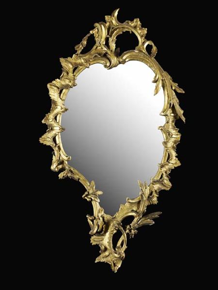 Appraisal: A George III carved giltwood wall mirror circa the shaped