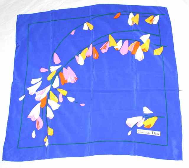 Appraisal: A CHRISTIAN DIOR SILK SCARF the design with white yellow