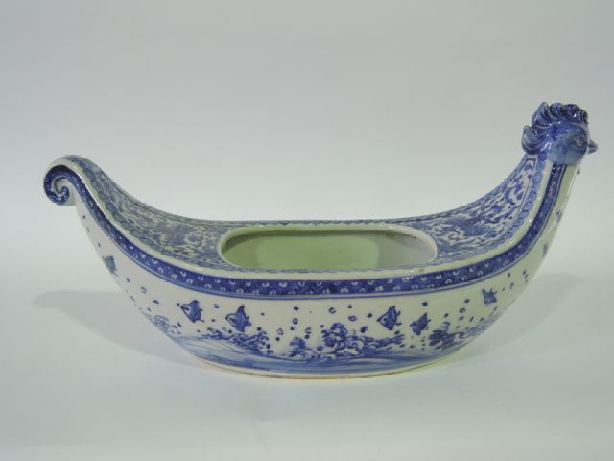 Appraisal: An unusual continental boat shaped vase with blue and white