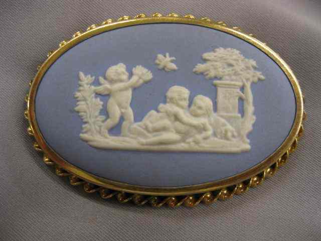 Appraisal: Wedgwood Blue Jasperware Brooch cherubs at play - '' x