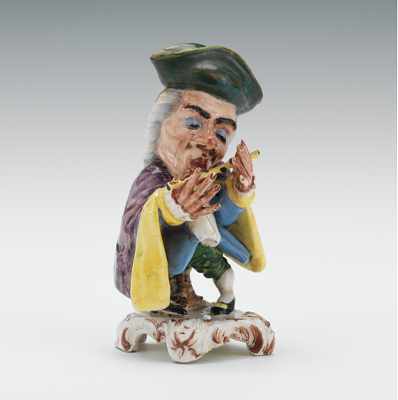 Appraisal: An Italian Majolica Figurine of a Dwarf Musician Ceramic dwarf