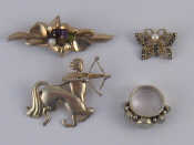 Appraisal: A mixed lot comprising three white metal brooches and a