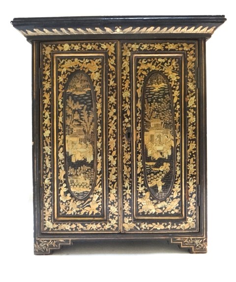 Appraisal: A Japanese lacquer table cabinet early th century gilt chinoiserie