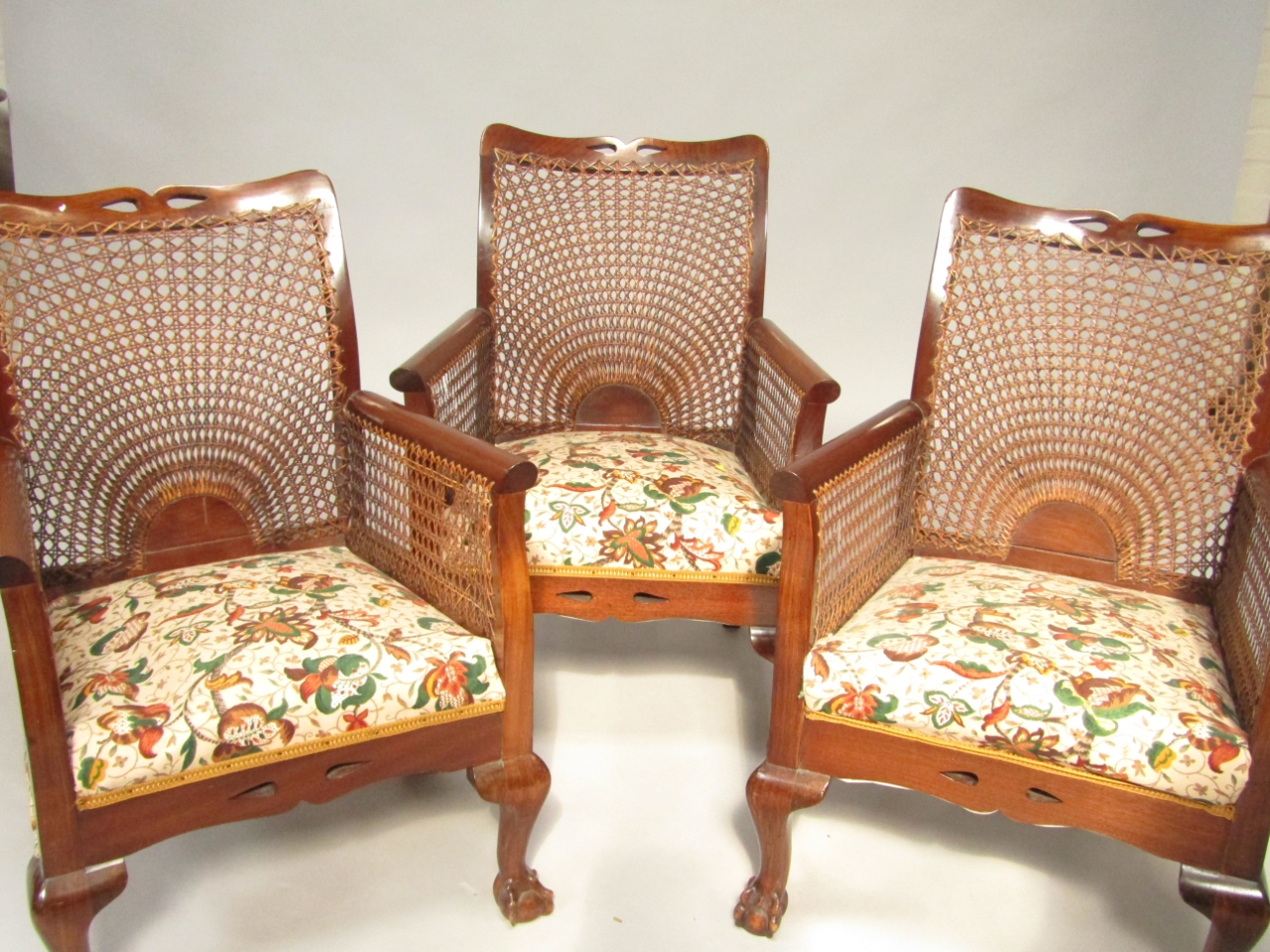 Appraisal: A set of three early thC mahogany bergere armchairs with