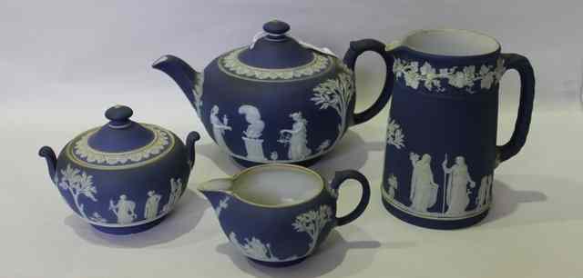 Appraisal: A WEDGWOOD BLUE JASPERWARE FOUR PIECE TEASET