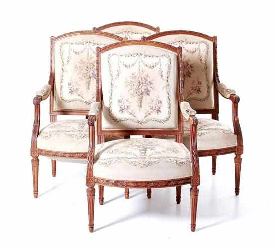 Appraisal: Set of four Louis XVI style carved walnut fauteuils late