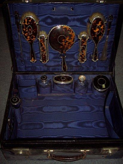 Appraisal: A dressing table case with part set tortoiseshell and silver