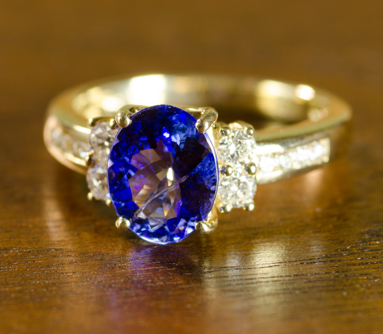 Appraisal: TANZANITE DIAMOND AND FOURTEEN KARAT GOLD RING with six round-cut