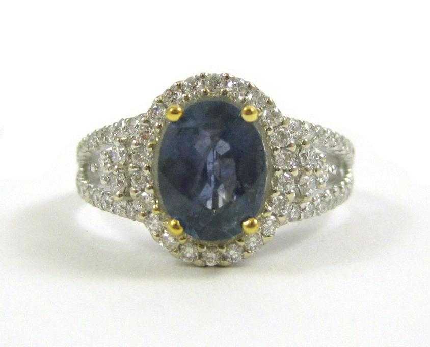 Appraisal: SAPPHIRE DIAMOND AND FOURTEEN KARAT GOLD RING The white and