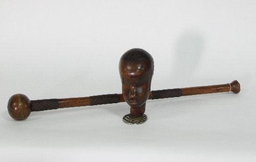 Appraisal: A knobkerrie club cm '' long and a carved head