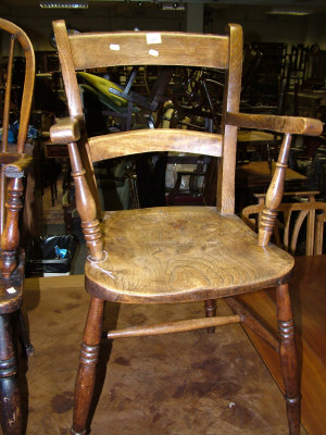 Appraisal: A figured elm and beech armchair stamped S C to