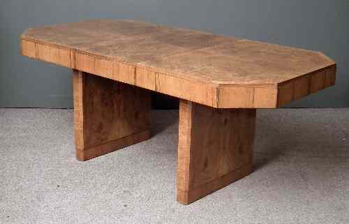 Appraisal: A figured walnut rectangular extending dining table of Art Deco