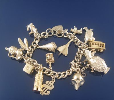 Appraisal: A gold charm bracelet the ct gold curb link bracelet