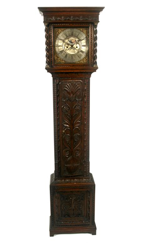 Appraisal: A th century heavily carved oak longcase clock By Thomas