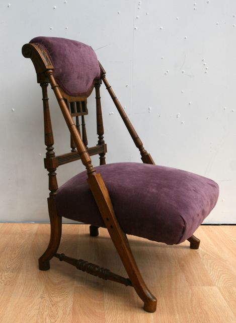 Appraisal: A late Victorian walnut and upholstery nursing chair