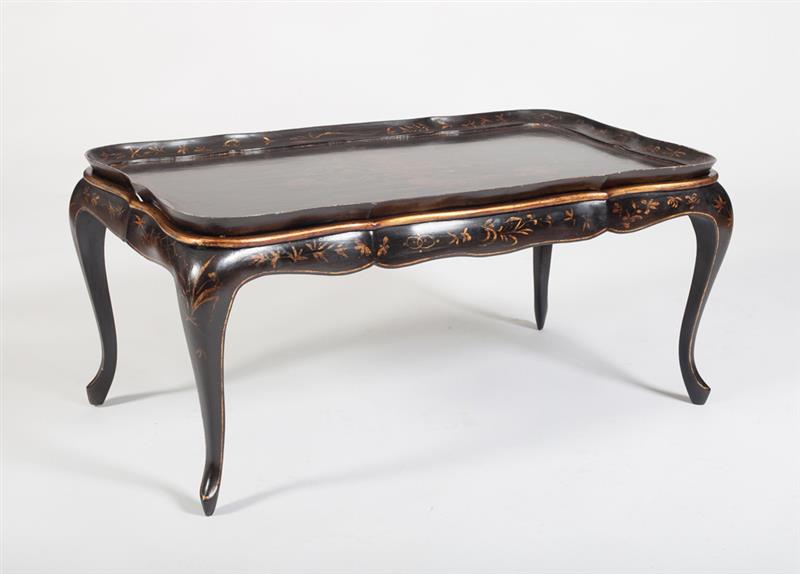 Appraisal: CHINOISERIE BLACK LACQUER TRAY TABLE The serpentine shaped tray top