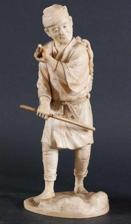 Appraisal: Japanese carved ivory figure of a fisherman th century figure