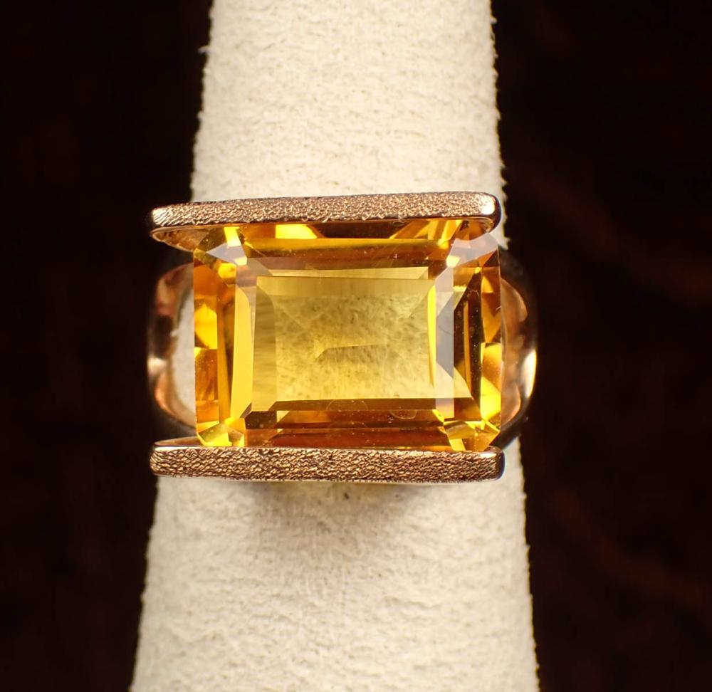 Appraisal: ORANGE SPINEL AND FOURTEEN KARAT GOLD RING The yellow gold