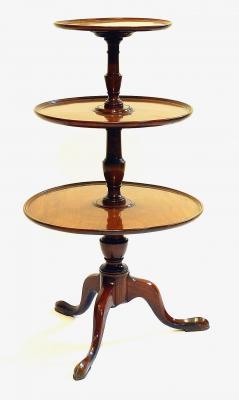 Appraisal: A GEORGE III MAHOGANY THREE TIER DUMB WAITER the dished