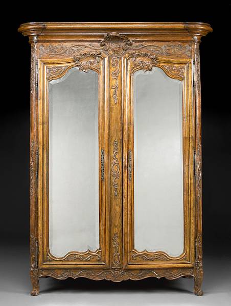 Appraisal: A Louis XV carved oak armoire mid th century With