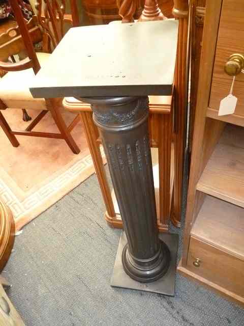 Appraisal: A COMPOSITE BRONZED TORCHERE in the form of a classical