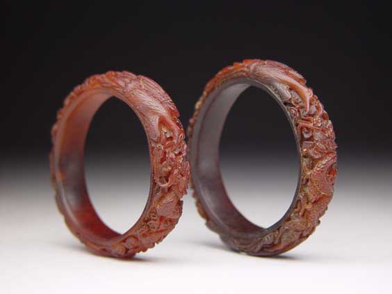 Appraisal: PAIR RHINO HORN BRACELETS Pair of intricately carved Chinese rhinoceros